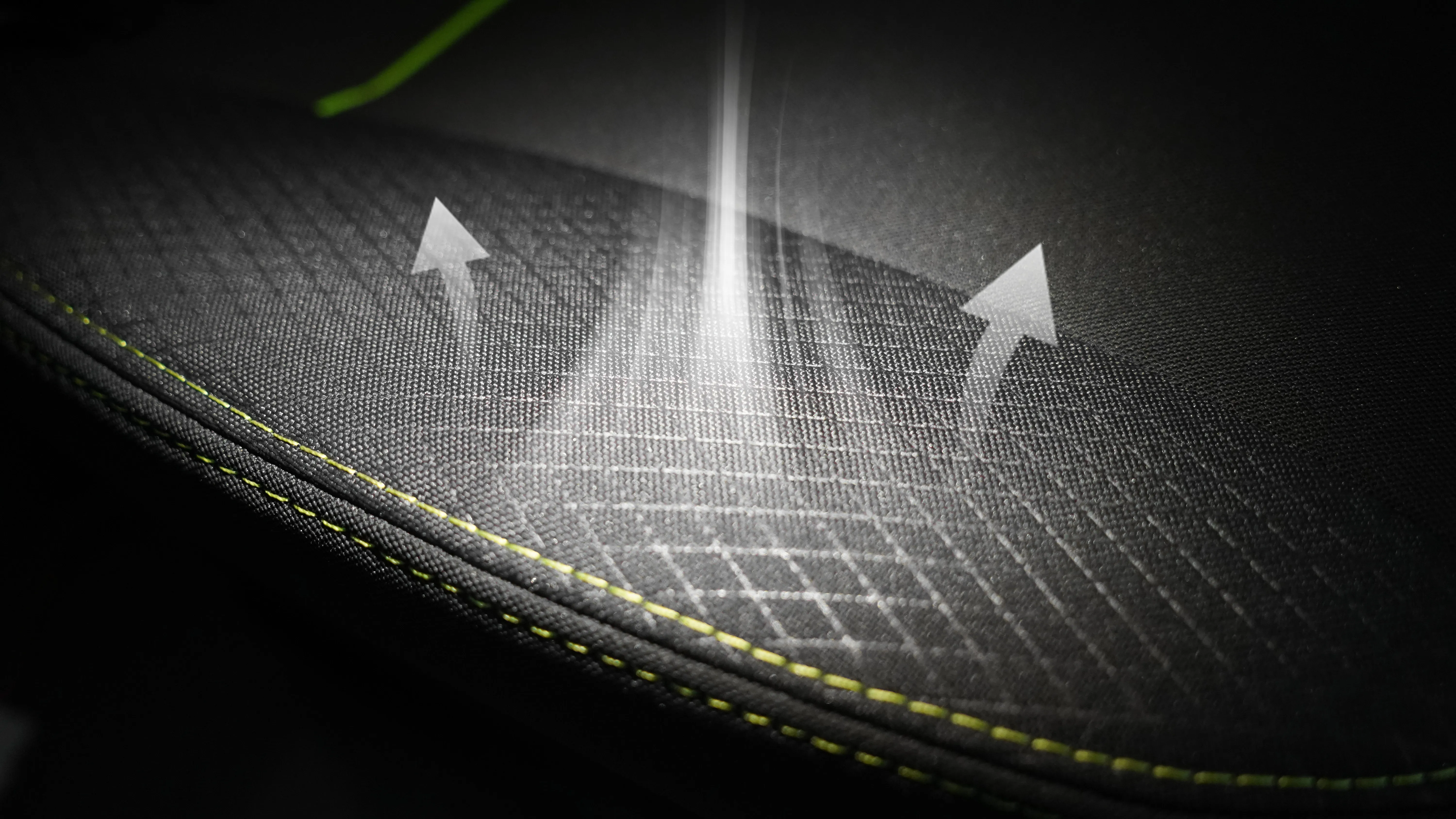 Close-up of dark perforated upholstery material